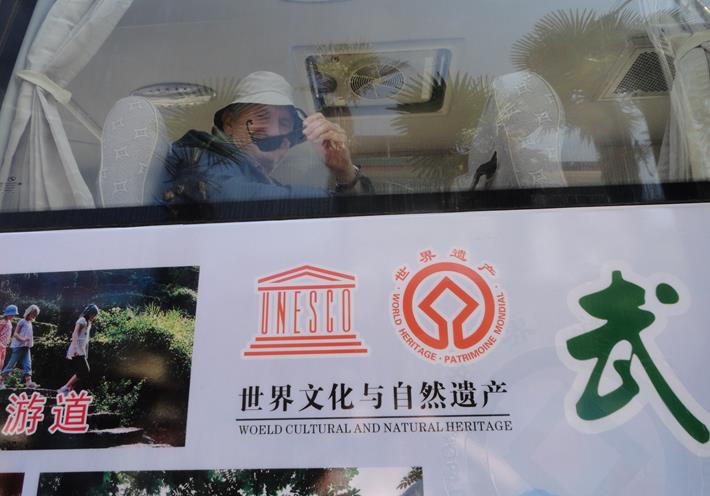 NZCFS Tours often visit World Heritage sites.  Wellington member David Litchfield aboard the bus inside the Wuyishan site, during the South-East China Tour, April 2013 
