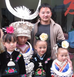 Our speaker Mr Zheng Yuanheng above with a group of Miao children in traditional dress