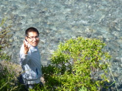 Bao Zhiming is happy as he has just drunk from a stream in Arthur's Pass National Park, South Island, NZ 