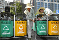 Double rubbish bins (for recyclables and 'other') being prepared for installation in Beijing for the Beijing Olympics, 2008