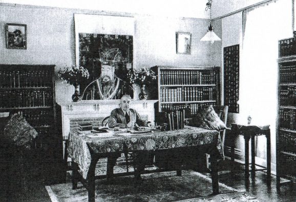 Joseph Rock in his study at Lijiang, undated. Taken from Aris , M. (1992). 'Lamas, princes and brigands: Joseph Rock's Photographs of the Tibetan Borderlands of China.' NY: China House Gallery. 