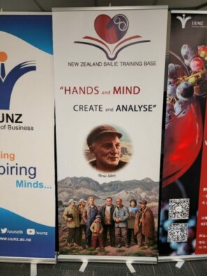 Banner from the New Zealand Bailie Training Base saing "Hands and mind create and analyse"