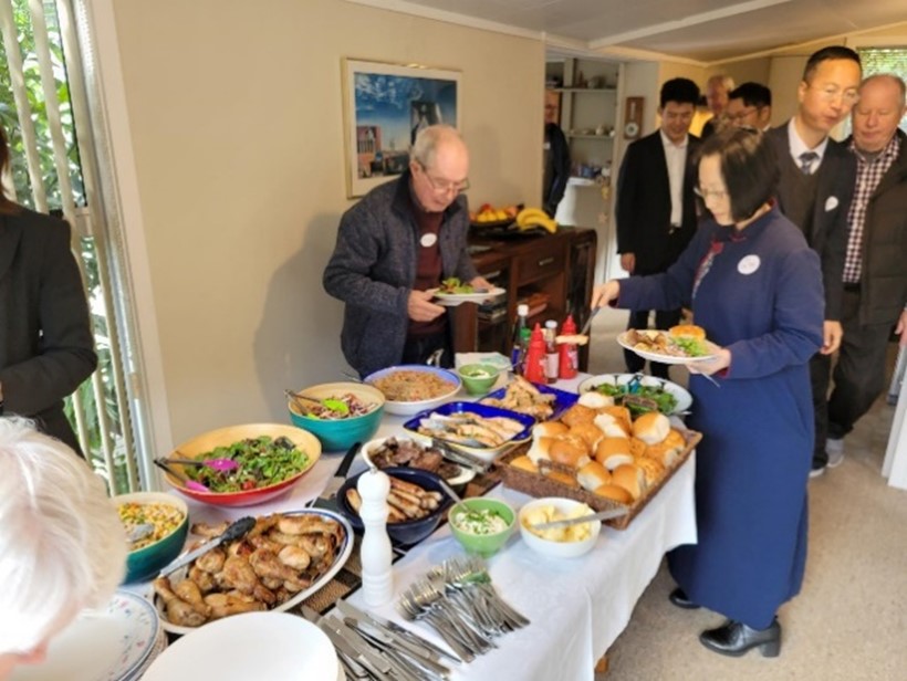 A buffet of food on offer with Consul General Madame He Ying and other attendees