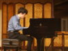 Zhuhai Mozart competiton finalist Benjamin Carter performing at the piano.